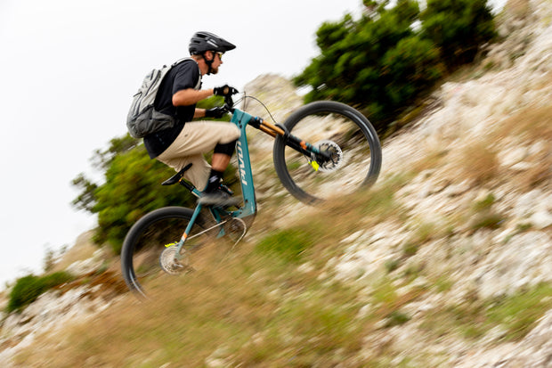 Cyclist riding an electric mountain bike uphill
