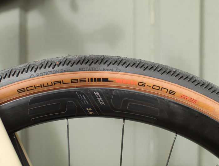 Close-up of a Schwalbe G-One RS bicycle tire on an Enve SES 3.4 Gravel Carbon wheel 