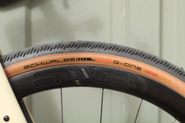 Close-up of a Schwalbe G-One RS bicycle tire on an Enve SES 3.4 Gravel Carbon wheel 